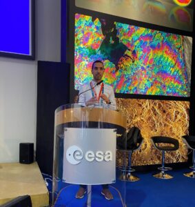 man behind a lectern making a speech